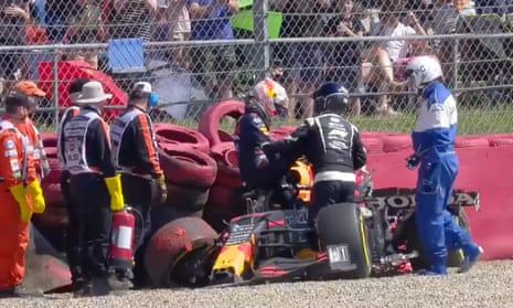 Max Verstappen climbs out of his car after the crash caused by Lewis Hamilton at Silverstone