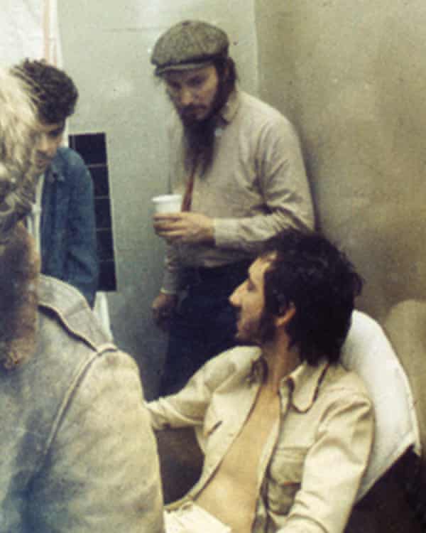 Russell Hardy, standing, with Pete Townshend, seated, of the Who, and Ian Dury, left, backstage at the Lyceum theatre, London, in 1973