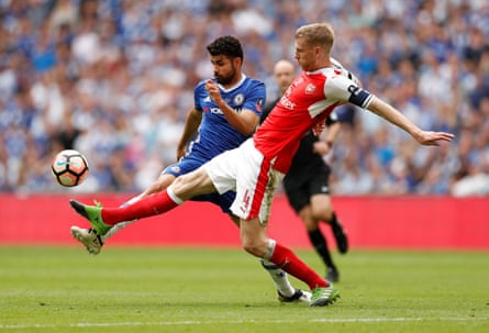 Per Mertesacker challenges Chelsea’s Diego Costa during Arsenal’s FA Cup final win last season