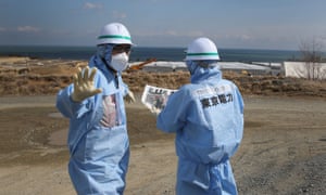 Contamination experts work at the site of the Fukushima disaster.