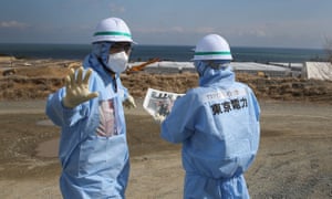 Workers oversee the decontamination and decommissioning process at Fukushima