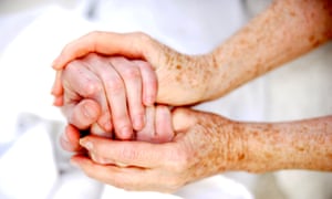 Holding hands of an elderly person