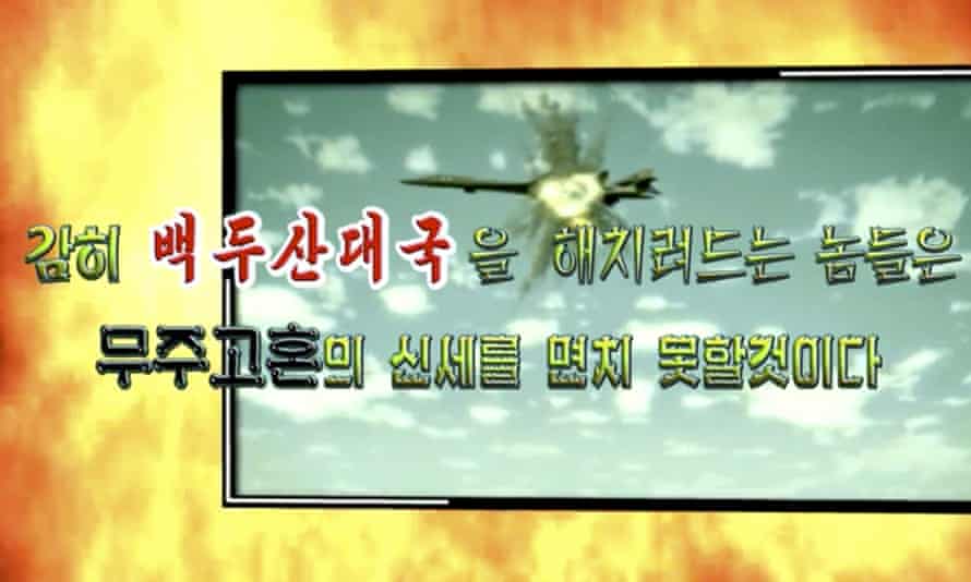 Image from propaganda video released by North Korea Tuesday shows a B-1B bomber hit by a missile.