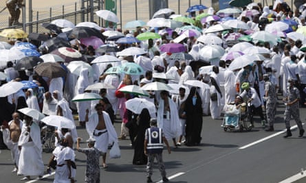 Pilgrims walk on a road in Mina, near the holy city of Mecca, September 2015.