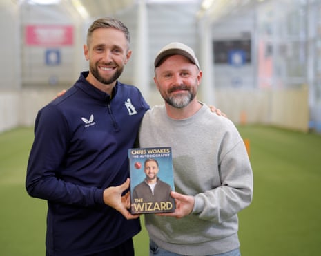 Chris Woakes and the GuardianâÂÂs Ali Martin with a copy of âÂÂThe WizardâÂÂ, WoakesâÂÂs new autobiography
