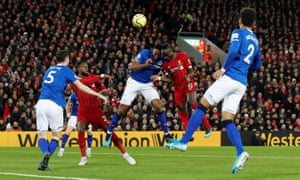 Liverpool’s Sadio Mane clashes heads with Everton’s Yerry Minaas the Liverpool player heads over.