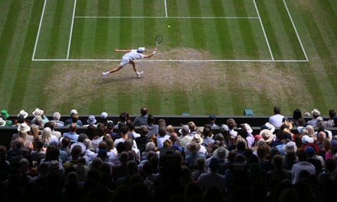 Jannik Sinner plays a forehand against Novak Djokovic during the men’s Wimbledon 2022 quarter-final.