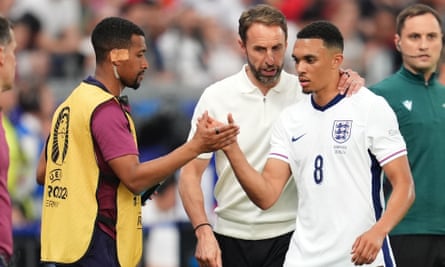 Gareth Southgate puts his arm round Trent Alexander-Arnold as he comes off the pitch