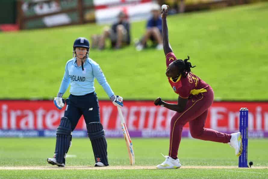 West Indies Shamilia Connell bowls as England's Tammy Beaumont looks on.