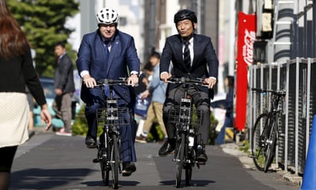 Johnson cycles with Tokyo’s Shibuya district mayor, Ken Hasebe
