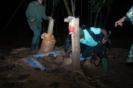 The elite patrol uncover a goldmine that has been covered with wood and sand in Téné forest, Ivory Coast. 