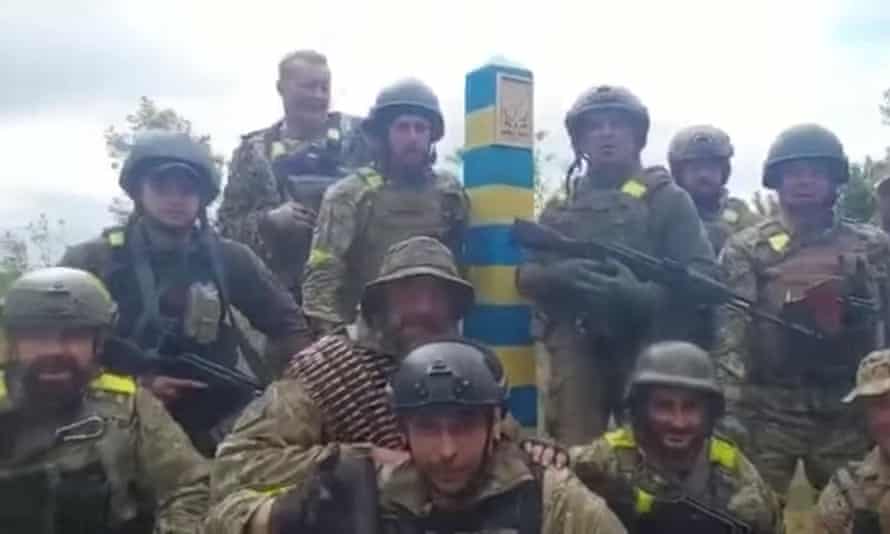 Ukrainian troops stand at the Ukraine-Russia border in what was said to be the Kharkiv region, Ukraine in this screen grab obtained from a video released on May 15, 2022. Ukrainian Ministry of Defence/Handout via REUTERS THIS IMAGE HAS BEEN SUPPLIED BY A THIRD PARTY. MANDATORY CREDIT
