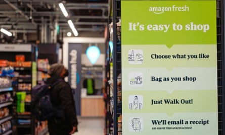 An Amazon Fresh store in London with a sign indicating how to use its Just Walk Out programme.