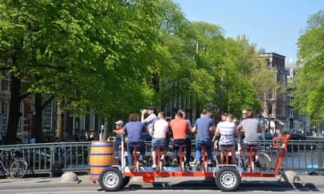 A group of men on a ‘beer bike’ in Amsterdam. On Tuesday a district court ruled the council could ban them from city streets. 