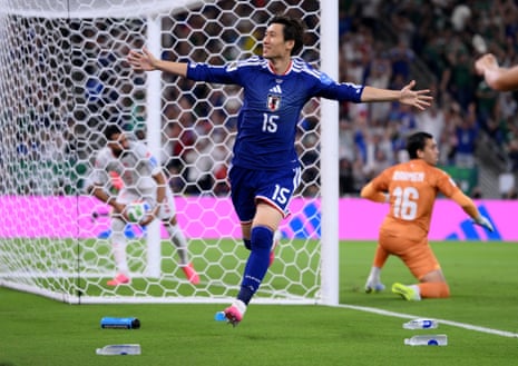 Daichi Kamada of Japan celebrates scoring his team's first goal.