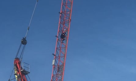 Alex Sidney scales a crane in Norwich.