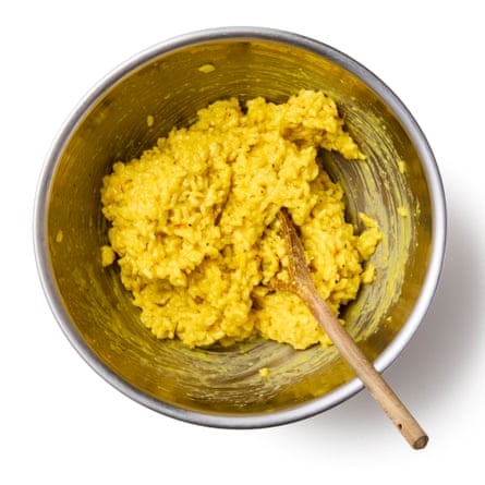 yellow rice for arancini... being formed into balls in a metal bowl