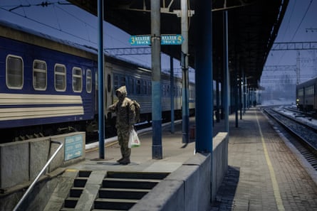 A soldier waiting at Zaporizhzhia railway station to board the train to Uzhhorod.