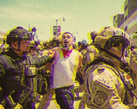 Law enforcement officers arrest a demonstrator outside the federal building as protests continue in response to federal immigration operations in Los Angeles on 10 June.