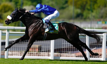 William Buick rides Opera Ballo to success in the bet365 Mile at Sandown.