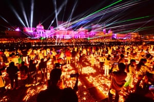 Ayodhya, India. People ticker  a laser amusement   connected  the banks of the stream  Sarayu during Deepotsav celebrations connected  the eve of the Hindu festival of Diwali
