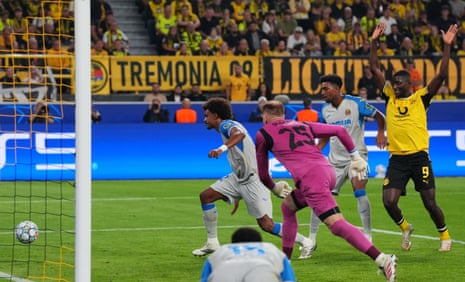 Villarreal's Renato Veiga (centre left) puts the ball in his own net to give Borussia Dortmund the lead.
