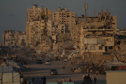 A road surrounded by collapsed buildings.