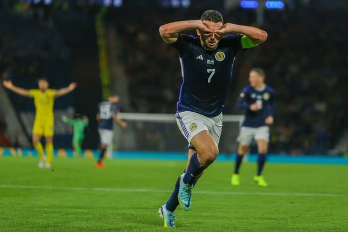 Scotland’s John McGinn celebrates after opening the scoring.