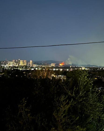 shot of flames on hill from far away