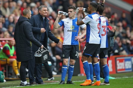 Blackburn manager Tony Mowbray talks to his players.