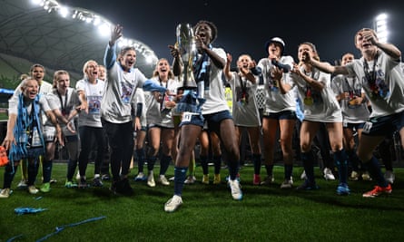 Sydney FC celebrate with the trophy after winning the A-League Women grand final match against Melbourne City.