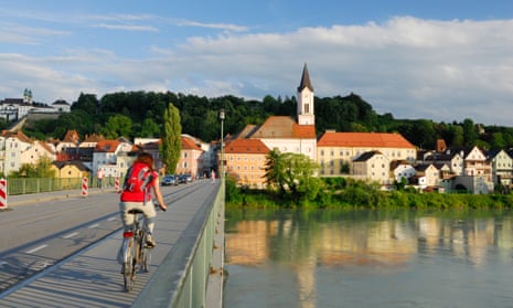 Cycling over the River Inn on the Danube Cycle Route in Passau, Lower Bavaria.