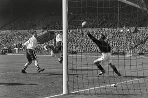 The injured Eric Bell rises above Eddie Shimwell to head past Farm.
