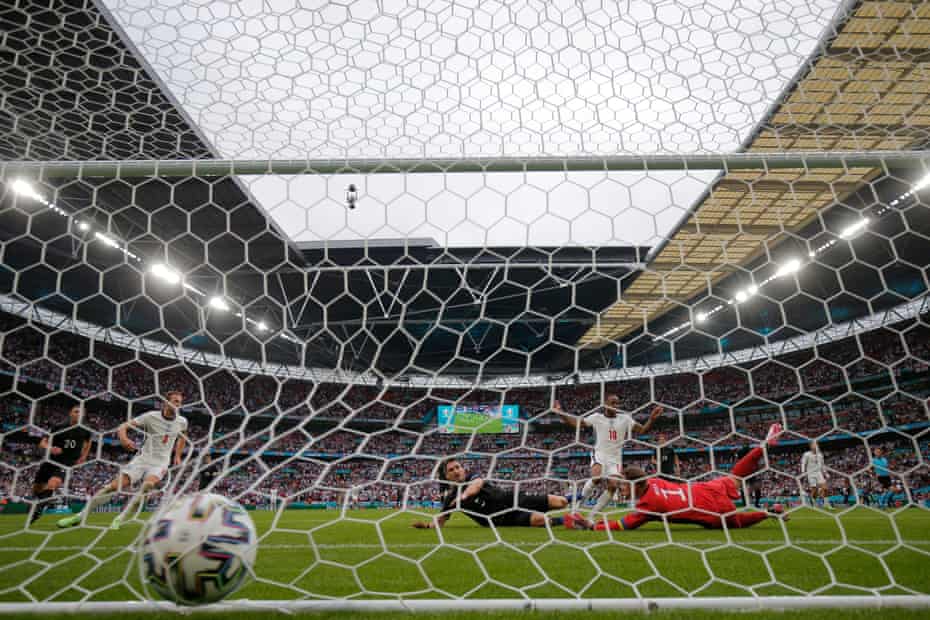 Raheem Sterling slots home the opener.