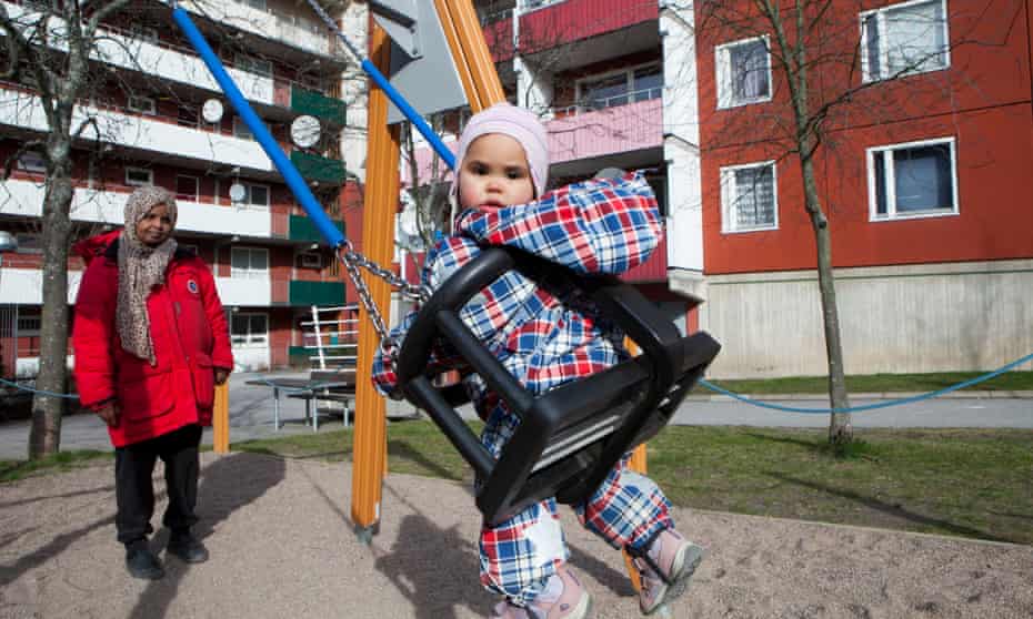 A  Somalian girl   in a playground  in the Husby neighbourhood of Stockholm,