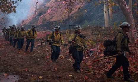 Firefighters hike into the Palisades wildfire in Los Angeles, California, USA, 11 January 2025. Thousands of firefighting and emergency personnel are involved in response efforts, as multiple wildfires are continuing to burn across thousands of acres in Southern California, destroying thousands of homes and forcing people to evacuate areas throughout the Los Angeles area. EPA/ALLISON DINNER