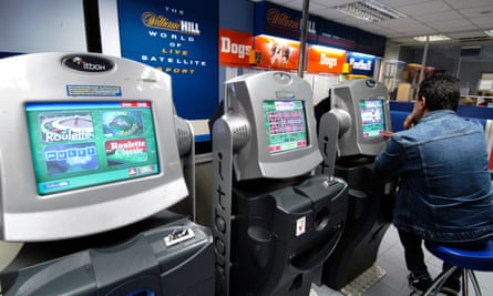 A man playing a fixed-odds betting terminal