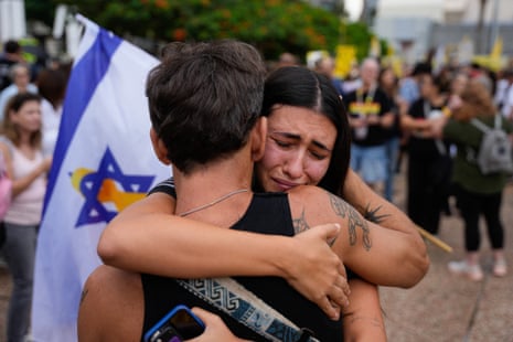 People react at Hostage Square in Tel Aviv on Thursday, after news of a Gaza ceasefire deal.
