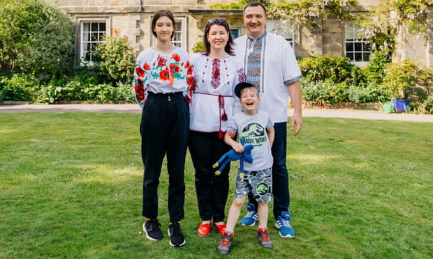 Ukranian refugee family Vadym Gonchar, his wife Inna and their two children, outside the home of their host family Steve and Jenny Rees, who live in the vicarage next door to All Saints Church in Crowborough. Crowborough, East Sussex, UK. 19th May 2022.