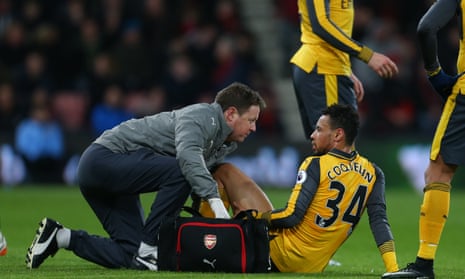 Francis Coquelin receives treatment after injuring his hamstring during Arsenal’s 3-3 draw with Bournemouth