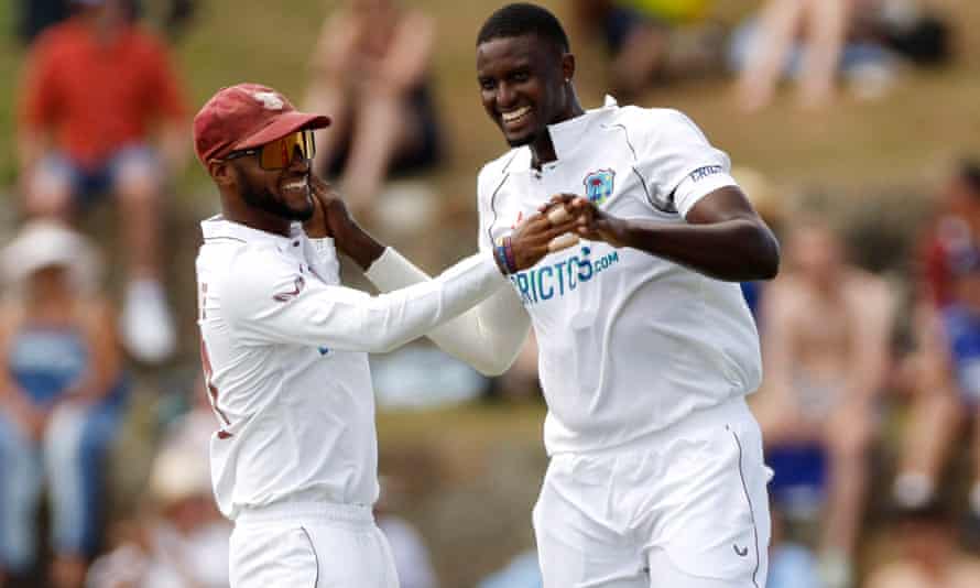 West Indies’ Jason Holder (right) celebrates after taking the wicket of England’s Dan Lawrence