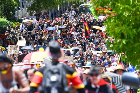 People march during an Invasion Day rally in Brisbane, Thursday, January 26, 2023. 