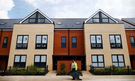 Sold new build homes are seen on a development in south London