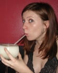 Head shot of producer Gwynne drinking a cocktail