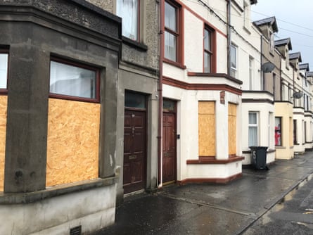 A street of boarded-up and occupied homes in Ballymena