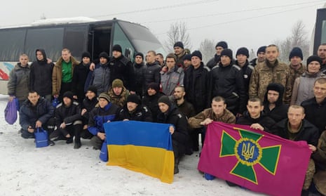 Freed Ukrainian prisoners following their exchange in an unknown location in Ukraine.