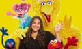 Dr Laurie Santos from The Happiness Lab podcast with the gang from Sesame Street. 