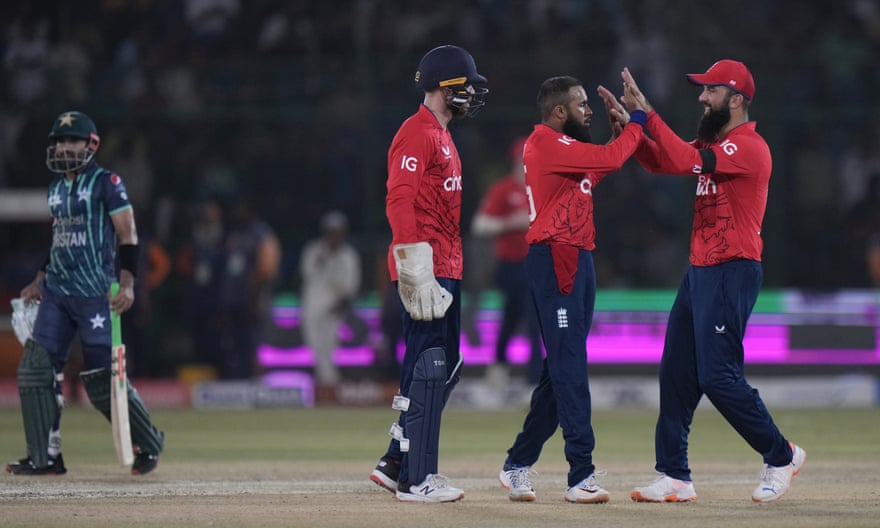 Adil Rashid (centre) is congratulated by Moeen Ali after dismissing Pakistan’s Babar Azam.