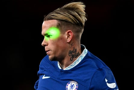 A green laser beam hits the face of Chelsea’s Mykhaylo Mudryk during their Premier League match against Arsenal at the Emirates Stadium