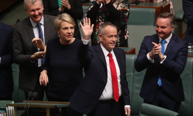 Bill Shorten waves to the galleries after delivering his budget reply speech on Thursday night.